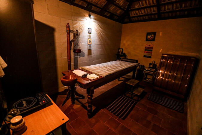 This is an image of a lady performing yoga onth ebanks of ganges in white robe