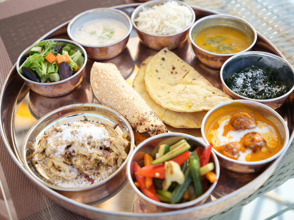 This is an image of 2 people seem s confuse about their destinations in India